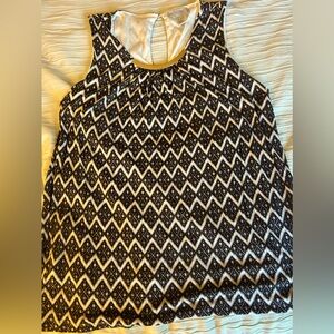 H&M large Gently used black and white top with gold embellishment.